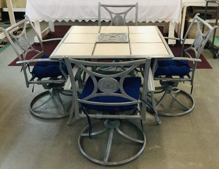 Like new patio set Table & Chairs that swivel & rock with new cushions 