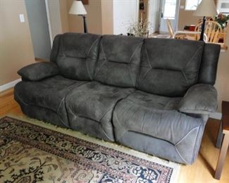 1 year old Microfiber style Sofa with recliner has a matching loveseat
