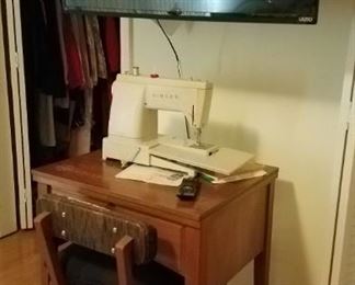 Portable Singer sewing machine and another Visio TV