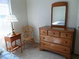 Wicker chair, maple nightstand, mirror and dresser, table lamp