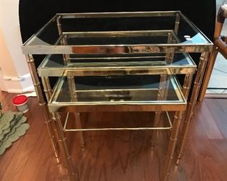 3 nestled brass and glass tables