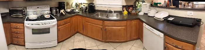 Panoramic view of the kitchen. Many small appliances.