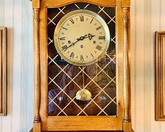 Vintage wall hanging pendulum clock.