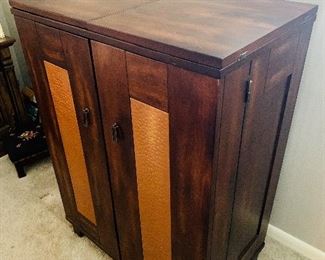 Mid century danish design dry bar cabinet with copper inlay.