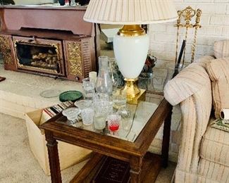Mid century two tier, glass top, cane bottom end table.
