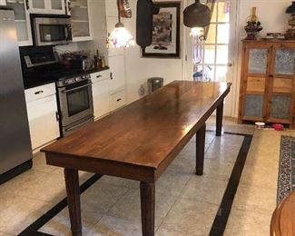 Vintage Library Table Converted to Farmhouse Table. 
This item was originally in a library then purchased to be converted into a harvest / farmhouse table for a dining area / kitchen. The table measures 10 feet in length, 34 inches across, and 30 inches in height. Table is in great condition and very sturdy.