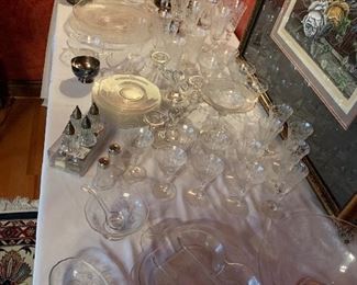 silver candlesticks and Fostoria(?) crystal serving pieces