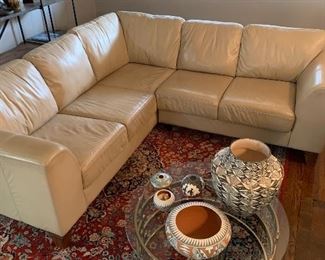Beautiful L shaped leather sofa and hand made Persian carpet of the best quality!