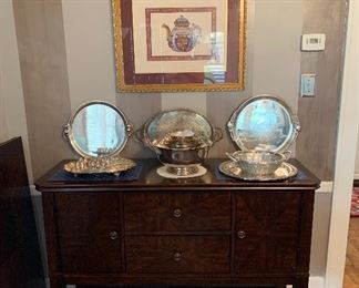 A lovely dining room buffet with silverplate  and sterling
