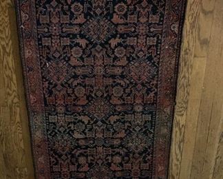Small Persian carpet at entry