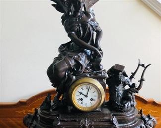 ITEM 6: ANTIQUE BRONZE TABLE CLOCK. Angel with Lyre. Dimensions: 27"H x 23"Wx 8”D.