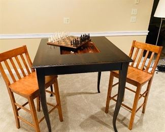 ITEM 20: CHESS & BACKGAMMON TABLE with 2 CHAIRS. Table Made in Italy Dimensions: 39”W x 39”L x 41.5”H Open central department with chess board and interior backgammon game. Chairs Dimensions: 41”H x 16”D x 18.5”W.