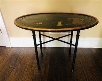 ITEM 15: OVAL LACQUER TRAY TABLE on a STAND decorated with a Japanese style landscape. Dimensions: 33''W x 21"D x 26"H. The wooden top can be also used as a tray or as decoration to hang on a wall.