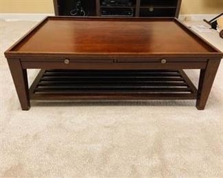 ITEM 23: SIGNATURE DESIGN RECTANGULAR COCKTAIL COFFEE TABLE. Four drawers with table extensions. Dimensions: 48"W x 36"D x 16"H (without top)