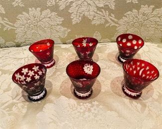 ITEM 69: Six Bohemian Ruby Red Small Glasses. Cut-to-clear. Diameter (mouth): 2.5". Height: 2.25".