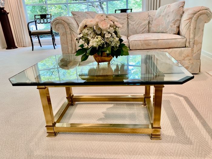 LaBarge brass and glass coffee table                    350.00                                                             16"H x 36"Lx 26"D                                                                                  (flower arrangement not for sale)