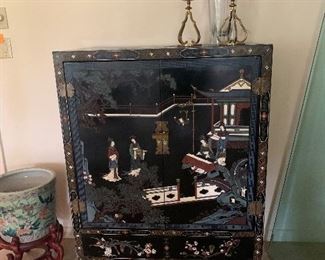 vintage lacquered cabinet with drawers featuring inlaid and applied decoration 