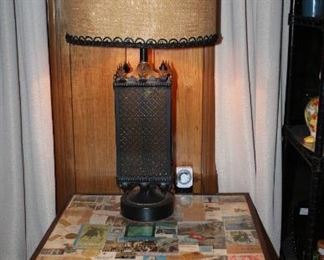 -Mid-Century 1960-70’s Black Metal Spanish Style Table Lamp.                                                                                                    -Mid-Century Square Table with Glass Insert Top Raised on Torpedo Style Legs