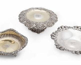 2
Three Tiffany & Co. Sterling Silver Serving Trays
Circa 1891-1902
Each stamped for Tiffany / Sterling; Further stamped with individual maker's marks and [T] for Charles L. Tiffany dates
Comprising one footed bon bon dish with ornate foliate rim, one berry bowl with pierced berry and leaf motif to rim, and one low dish on four feet with hammered floral and shell edge each personalized to center, 3 pieces
Tallest: 3.25" H x 7.25" Dia.
25.680 oz. troy approximately
Estimate: $1,000 - $2,000