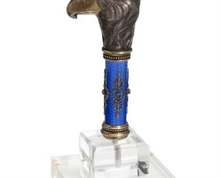 12
A Fabergé Sterling Bird Head Cane Handle On Lucite Stand
Late-19th/early-20th Century
Stamped in Cyrillic for Julius Rappoport and Faberge: [Imperial Warrant] / [Cyrillic Faberge Initials] / [IP]
The eaglet head on a royal blue enamel staff
Overall: 7.75" H x 3.625" W x 3.75" D; Faberge: 5.5" H x 1.375" W x 2.5" D
Estimate: $2,500 - $3,500