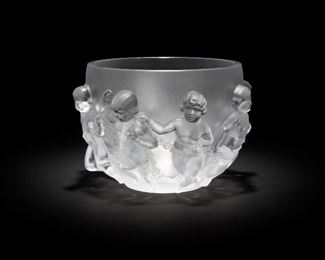 15
A Lalique "Luxembourg" Cherub Bowl
Fourth-quarter 20th Century
Acid etched to underside: Lalique / France
The large center-bowl depicting frolicking cherubs
8.375" H x 13" Dia
Estimate: $1,200 - $1,800