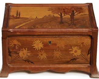 18
A Marquetry Inlay Table Top Jewelry Box
Circa 1900
Signed in inlaid wood to lid: Galle
The Art Nouveau jewelry box with hinged lid, inside mirror, and lift-out shallow drawer
7.75" H x 13.5" W x 9.5" D
Estimate: $1,200 - $1,800