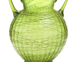 22
A Loetz Iridescent Glass Vase
Late 19th/early-20th Century; Bohemia (Czech Republic)
The two-handled Art Nouveau green glass vase with hand-applied threading texture
12.125" H x 9.5" Dia.
Estimate: $800 - $1,200