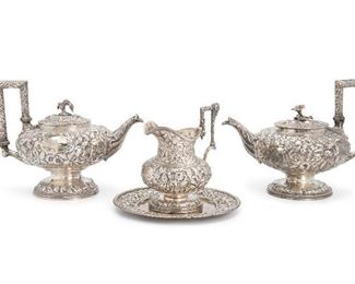 25
Four S. Kirk And Sons "Repousse" Sterling Silver Objects
Circa 1868-1890
Each stamped: S. Kirk & Son / 11 oz; Three pieces personalized
Comprising two tea kettles, one cream jug, and one plate, 4 pieces
Larger kettle: 8" H x 11" W x 6.75" D
91.240 oz. troy approximately
Estimate: $2,000 - $3,000