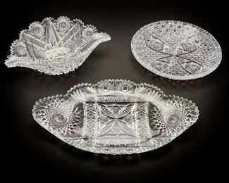 37
Three American Brilliant-Cut Glass Items
Late-19th/early-20th Century
Apparently unmarked
Comprising a round plate, a small center dish, and a large oval center bowl each with sawtooth edges, 3 pieces
Largest: 1.875" H x 17.25" W x 10.125" D
Estimate: $800 - $1,200