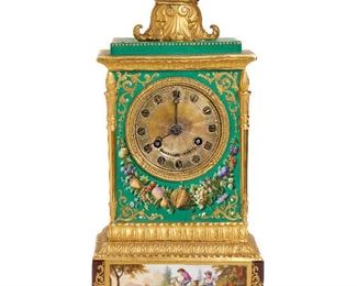 40
A Jacob Petite Painted Porcelain Clock
Fourth-quarter 19th century, France
Stamped: Guyerdel Paris
The pale green, maroon, and gilt Rococo-revival painted porcelain clock with Roman numeral hour markers surrounded by a gilt bronze ring and painted fruit and pastoral scenes topped by a small dish
17.125" H x 9.5" W x 7.5" D
Estimate: $2,000 - $3,000