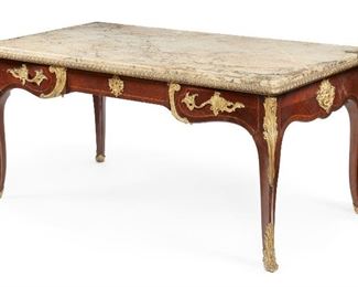 41
A French Louis XV-Style Bureau Plat
19th century
Signed with plaque inside drawer: Maison Forest / J. Bezier / Paris / 31 rue cambaceres
The marble top over two side drawers with gilt-bronze mounts and rectangular form parquetry body on paw feet
30.5" H x 64" W x 35" D
Estimate: $3,000 - $5,000