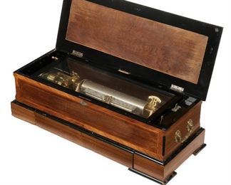 55
A Swiss Music Box
Fourth-quarter 19th Century
Apparantly unsigned
The wood case with two cylinders, hand crank, repeat/change switch, and lower storage drawer
10.5" H x 33" W x 13" D
Estimate: $1,000 - $2,000