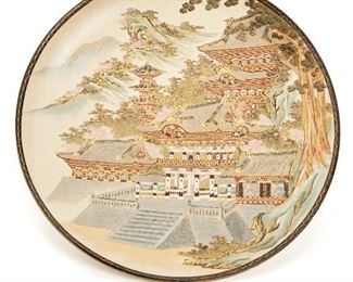 59
A Japanese Satsuma Charger
Second-half 20th Century
Makers mark painted to base
Depicting a temple set against a cherry blossom and mountain landscape
2" H x 14.25" Dia
Estimate: $600 - $800