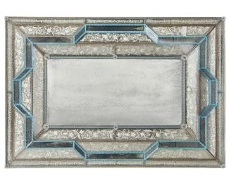 72
An Italian Venetian Wall Mirror
20th century; Post-war
Etched floral design to faceted border with blue and grey glass trim and rosettes
37" H x 54" W x 3" D
Estimate: $800 - $1,200