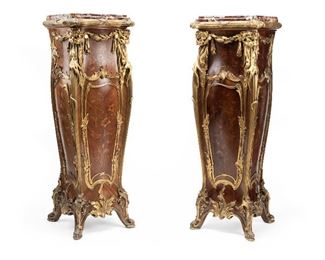 79
A Pair Of Louis XV-Style Pedestals
Late-19th Century
Each with marquetry-inlaid bodies, marble tops, and lion-head gilt-bronze mounts, 2 pieces
Each approximately: 52" H x 19" W x 17" D
Estimate: $8,000 - $12,000