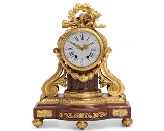 82
A French Red Rouge Marble And Gilt-Bronze Clock
Fourth-quarter 19th Century
Stamped to mechanism: 2111 / ND
The rouge marble base with bronze bow and arrow, laurel wreath, and torch over a white dial with Roman and Arabic numeral markers and bronze mounts on a rouge marble column over decorative bronze onion feet
19" H x 15.5" W x 7.25" D
Estimate: $1,500 - $2,500