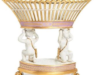 85
A Paris Porcelain Figural Reticulated Basket
Second-quarter 19th Century, Empire Period; France
Apparently unmarked
The basket being held up by two cherubs on paw feet with lilac and gilt detail
14.375" H x 16.5" W x 8.5" D
Estimate: $1,500 - $2,500