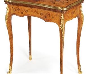 86
A Linke Flip Top Game Table
Late-19th Century
Signed to one bronze mount: F. Linke
The marquetry inlaid game table with green felt interior surface and gilt-bronze mounts on scroll feet
Open: 30" H x 32.5" W x 26.25" D; Closed: 29.5" H x 17" W x 26.25" D
Estimate: $4,000 - $6,000
