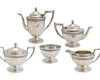 91
A Bailey, Banks, Biddle & Co. Sterling Silver Tea Set
20th Century
Each stamped with maker's mark: Bailey Banks Biddle & Co / Sterling / 48; Some further stamped
Comprising a coffee pot, a tea pot, a cream jug, a sugar bowl, and a waste bowl, the coffee and tea pots with an applied eagle to body marked: 1919, 5 pieces
Coffee pot: 8.25" H x 8.25" W x 7.75" D
51.130 oz. troy approximately
Estimate: $2,000 - $3,000