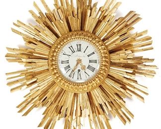 107
A French Carved And Gilt Wood Wall Clock "DeTouche"
Late-19th Century; France
Signed to dial: C. DeTouche / Paris
The sunburst-style giltwood clock with white dial and red and black Arabic and Roman numeral markers
30" Dia. x 6" D
Estimate: $3,000 - $4,000