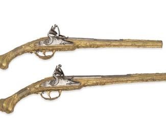 125
A Pair Of Continental Vermeil Flintlock Dueling Pistols
19th/20th Century
Each engraved: R.P. FANN (?) to top of octagonal to round barrel
Approx. .58 caliber, 2 pieces
Length: 13"; Overall pistol length: 20"
Estimate: $1,000 - $2,000