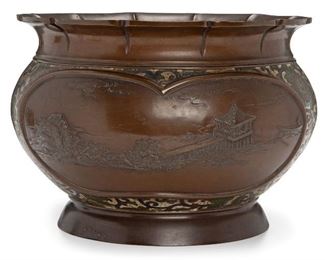 149
A Japanese Champlevé Enamel And Bronze Jardinière
Late-19th/early-20th Century
Apparently unmarked
The squat bronze jardiniere with landscape scenes set in a floral champleve body with wide scalloped rim
10" H x 14" Dia.
Estimate: $600 - $900