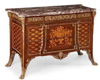 153
A French Commode With Marble Top
Second-quarter 20th Century
The commode with marble top over three long drawers, all-over marquetry inlay and bronze mounts on paw feet
35" H x 50.5" W x 22" D
Estimate: $4,000 - $6,000