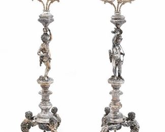 176
A Pair Of German Silver Three-Light Candelabra
Circa 1891-1906, Hanau
Each with pseudomarks to base for George Roth
Each on shaped base supporting three winged putto-form monopodiae, supporting a knopped column with figure of Cupid supporting three leaf-clad branches with vase-form sockets
Each: 27" H x 8.5" Dia.
233.07 oz. troy approximately
Estimate: $4,000 - $6,000