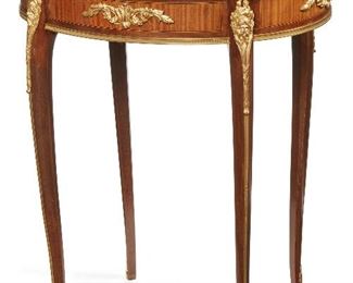 190
A François Linke Marble Top Gueridon Table
Late-19th/early-20th Century
Signed to mount: F Linke
The oval marble top over a gilt-bronze mounted apron, cabriole legs, and terminating in hoof-shaped caps
29" H x 23.75" W x 18" D
Estimate: $3,500 - $4,500
