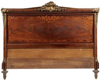 191
A French Louis XVI-Style Headboard
Late-19th Century
The wood body with marquetry inlay and gilt bronze shell and lion-shaped mounts
48.5" H x 62" W x 5" D
Estimate: $800 - $1,200