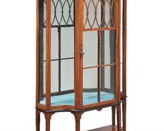 193
A Satinwood Vitrine Cabinet
First-quarter 20th century
With satinwood inlays, mirrored back, teal velvet floor, and glazed single door and sides
75" H x 40" W x 14" D
Estimate: $1,000 - $1,500