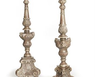 214
A Pair Of Carved Spanish Silverwood Pricket Sticks
Late-19th Century
Each pricket stick with foliate shaped metal candle holder over a carved shaft and tripod base, 2 pieces
38.25" H x 11" Dia.
Estimate: $600 - $800