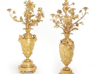 231
A Gilt Bronze-Mounted Candelabra
Early-20th Century
Each six-light gilt-bronze candelabra with floral arms and a tall central lily-shaped stem over an urn-shaped base decorated with horned animals and cherubs on four bun-shaped feet, 2 pieces
Each approximately: 34" H x 15" Dia.
Estimate: $1,800 - $2,200