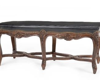 233
A Louis XV-Style Long Carved Walnut Bench
Circa 1900
The bench with leather seat and brass studs over a carved floral apron and double X-form stretcher bars on six legs
18.5" H x 44" W x 17.25" D
Estimate: $800 - $1,200